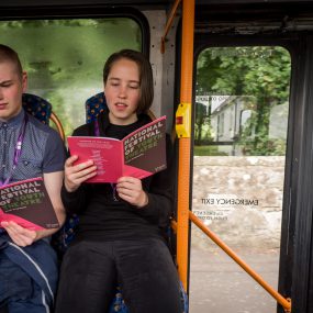 Reading a book on a bus